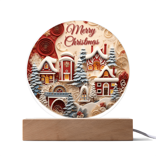 Winter House Acrylic Desk Plaque with illuminated wooden LED base, featuring a winter village scene with snow-covered cottages, evergreen trees, and "Merry Christmas" text.