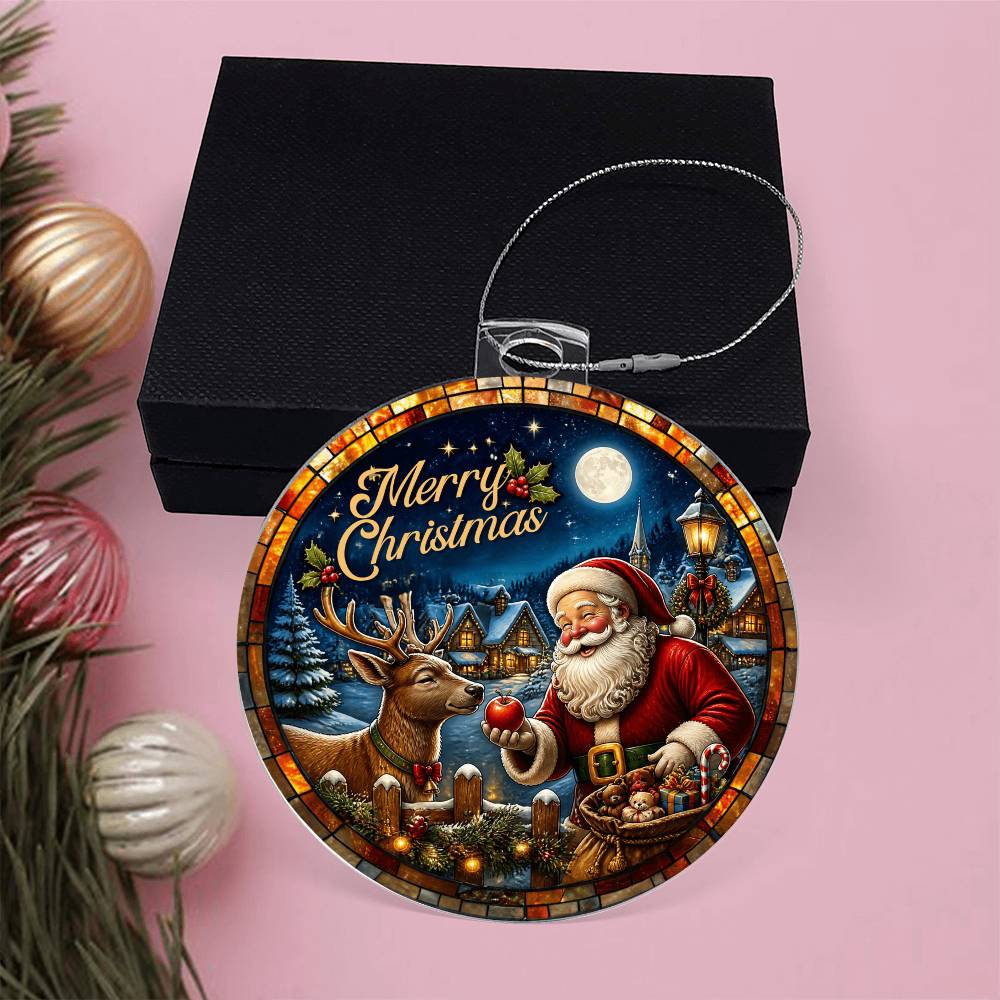 Santa and reindeer acrylic Christmas ornament displayed in front of a black gift box.
